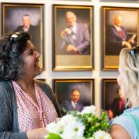 Dr. Rhodes talks with family members